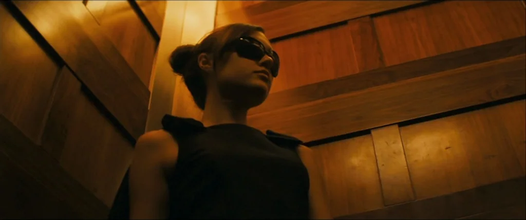 The Girlfriend Experience (2009) movie still: medium — A confined space lined with vertically and horizontally oriented polished wood panels. A…