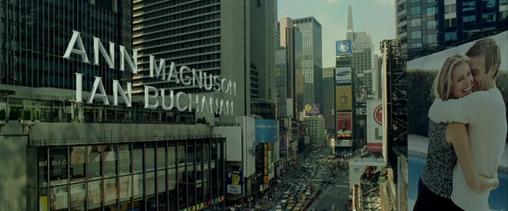 Panic Room (2002) movie still: establishing — A high-angle view of Times Square with numerous skyscrapers and large illuminated billboard…