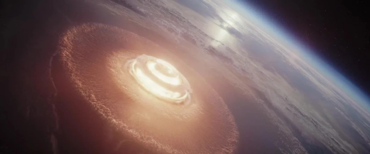 Rogue One: A Star Wars Story (2016) movie still: establishing — A view of the Earth from orbit showing a massive circular explosion on land. The…