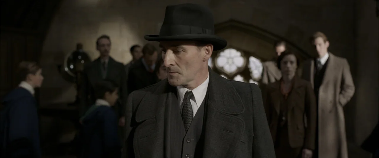 Fantastic Beasts: The Crimes of Grindelwald (2018) movie still: medium — A stone cathedral interior contains a group of people standing in the…