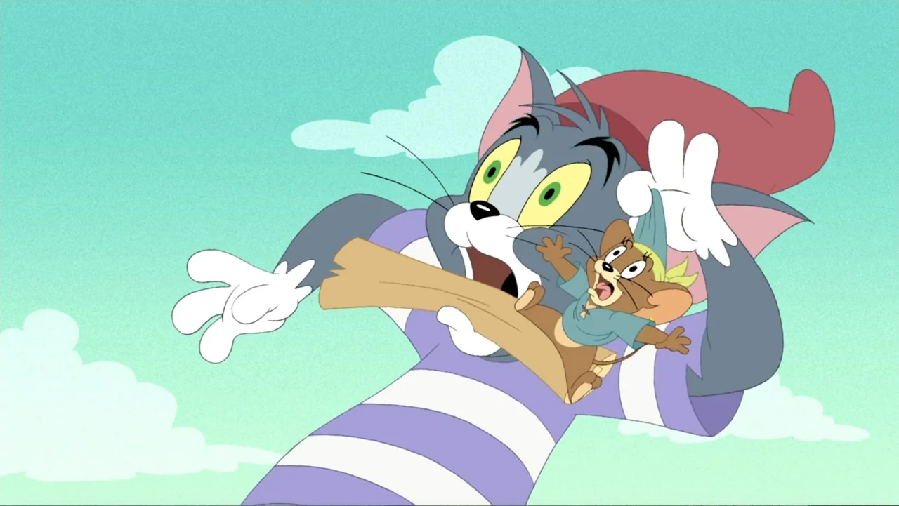 Tom and Jerry: Shiver Me Whiskers (2006) movie still: medium — A clear blue sky with stylized white clouds in the background. A gray cat carries a…