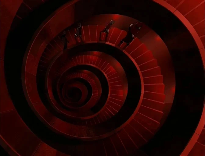 Avatar: The Last Airbender (2005) movie still: wide — A deep, winding spiral staircase constructed of dark metal and red-painted steel. Four figures…