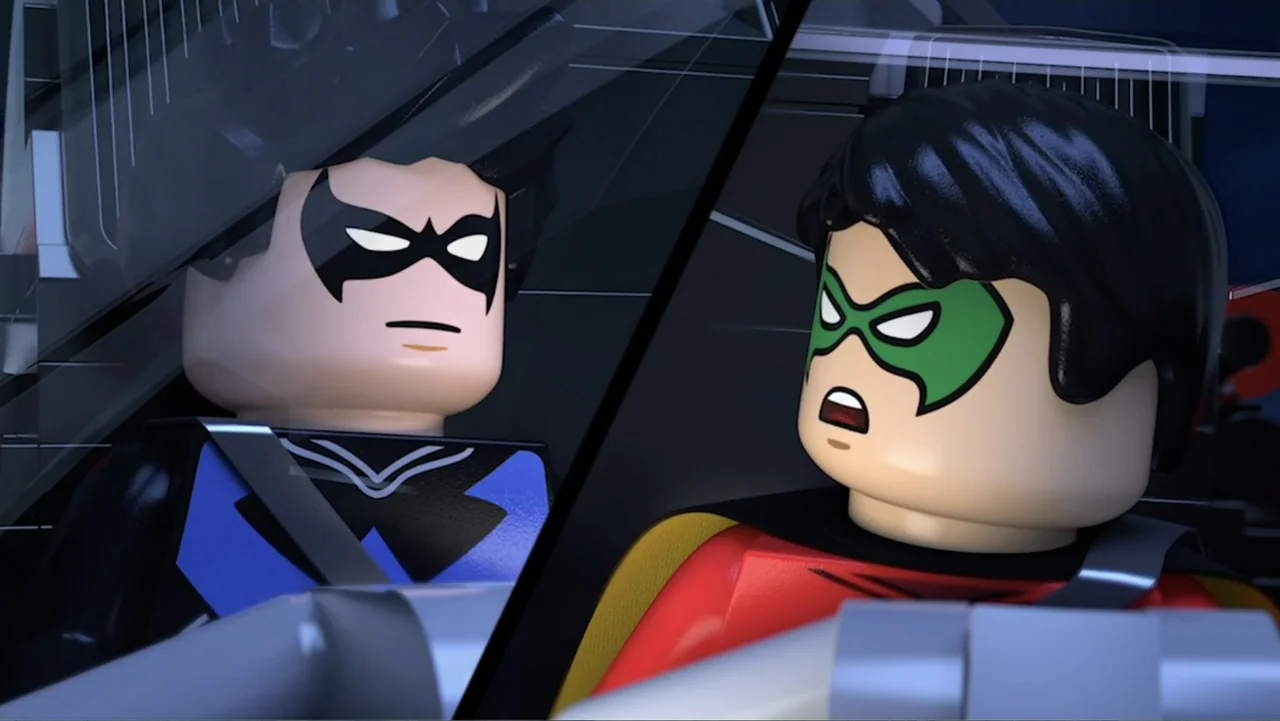 LEGO DC Batman: Family Matters (2019) movie still: medium — The interior of a vehicle shows two lego minifigures sitting in seats. The characters…