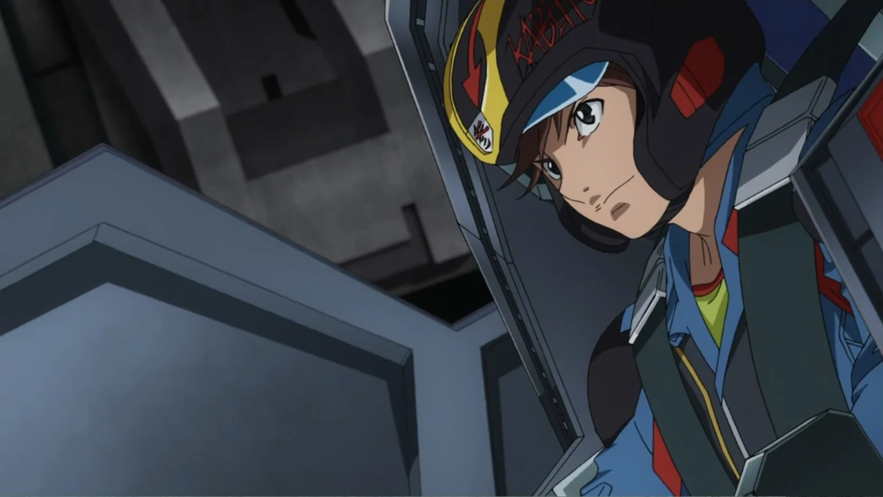 Mazinger Z: Infinity (2017) movie still: medium — A close-up of a pilot inside the metallic cockpit of a flight vehicle. The pilot wearing a helmet…