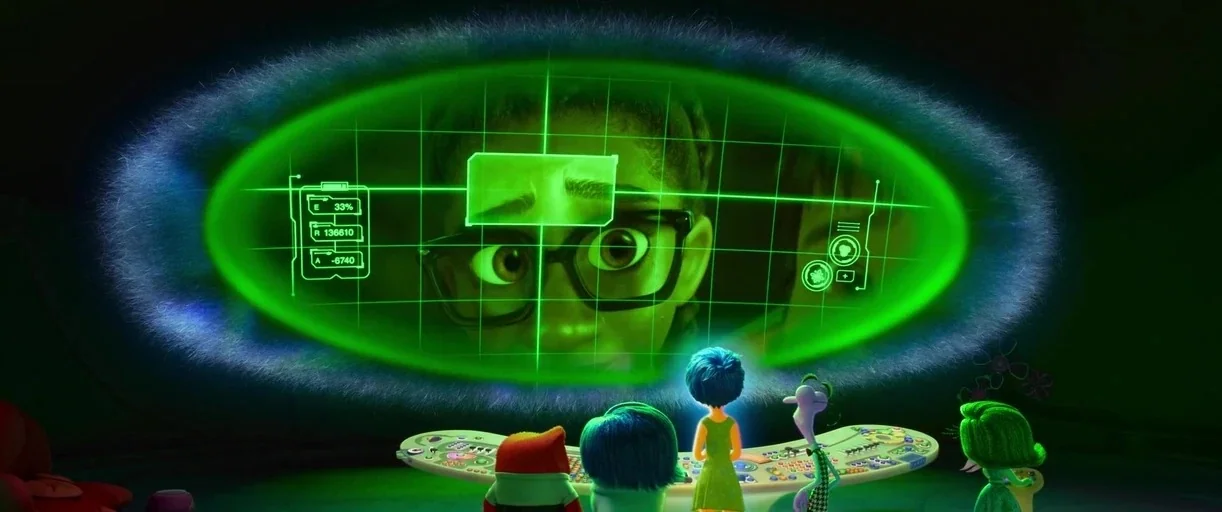 Inside Out 2 (2024) movie still: wide — A dark, futuristic control room with a large glowing green monitor floating in space. Small animated figures…