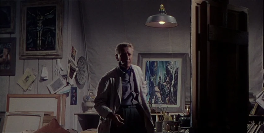 Magnificent Obsession (1954) movie still: medium — An artist studio contains numerous framed paintings, sketches, and canvases scattered on wooden…