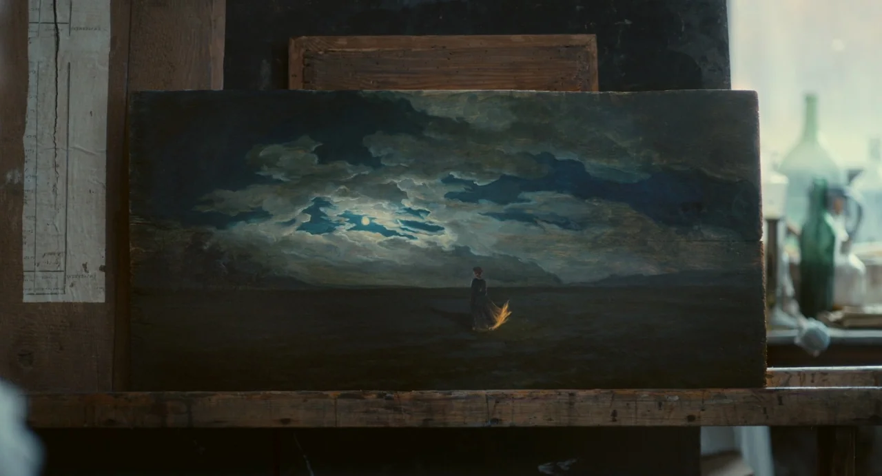 Portrait of a Lady on Fire movie still: medium — An artist's studio contains a wooden easel holding a dark, rectangular oil painting. The painting…