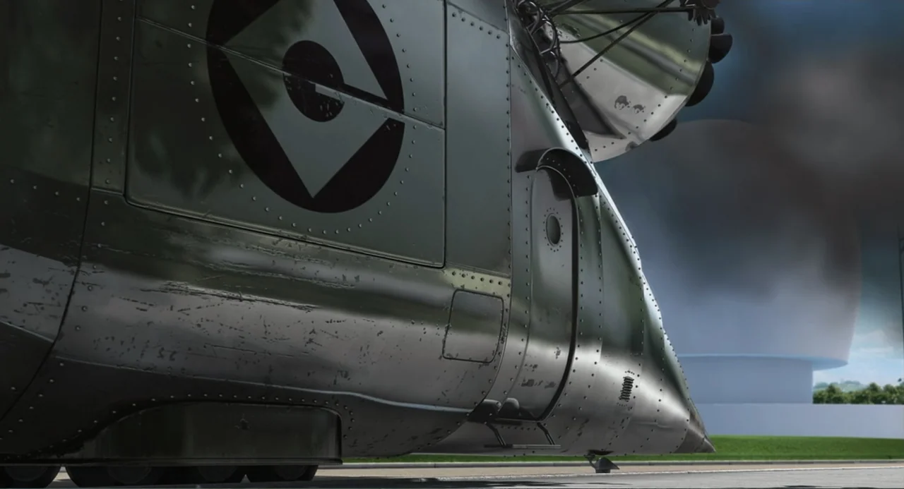 Despicable Me (2010) movie still: wide — A metallic, rivet-covered aircraft with a circular logo sits on a flat asphalt surface. A large white…