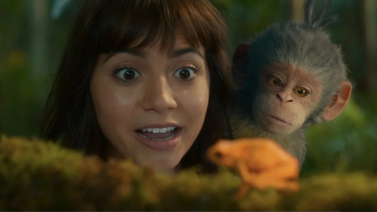 Dora and the Lost City of Gold (2019) movie still: closeup — A dense lush jungle environment with thick green foliage and moss-covered branches. A…