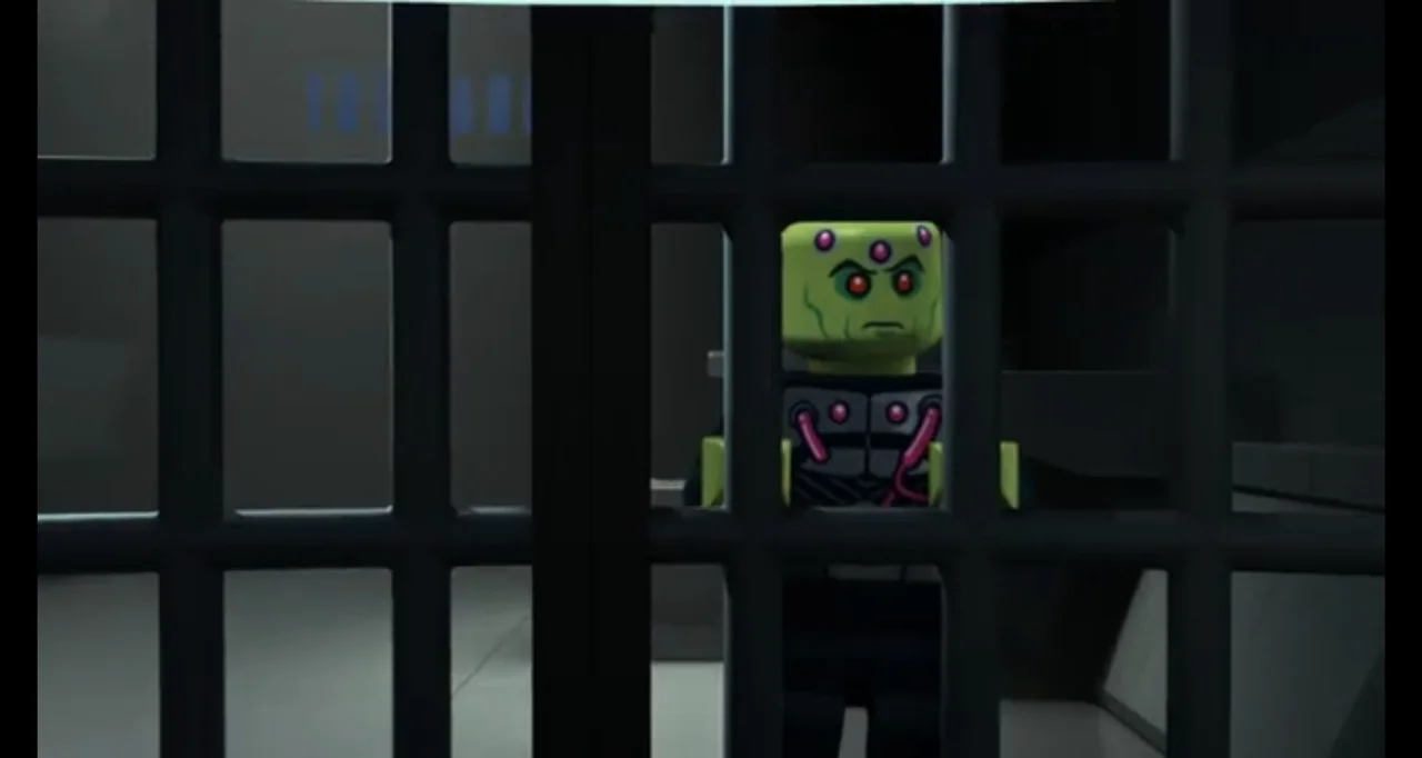 LEGO DC Comics Super Heroes: Justice League - Cosmic Clash (2016) movie still: medium — A dimly lit room features black metal bars partitioning the…