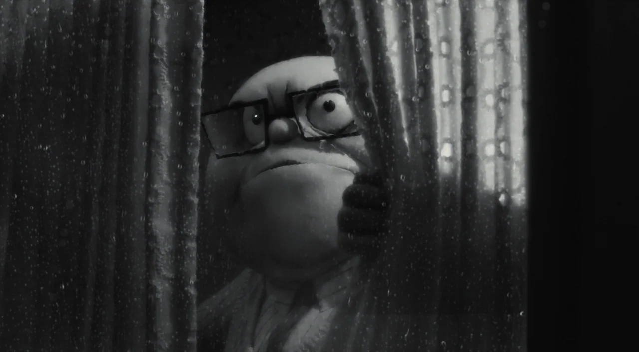 Frankenweenie (2012) movie still: closeup — A dark interior space viewed through a glass window pane covered in raindrops. An elderly man with large…