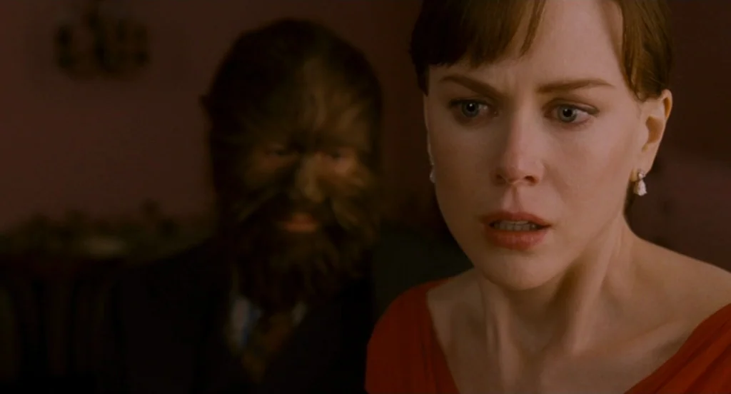 Fur: An Imaginary Portrait Of Diane Arbus (2006) movie still: medium — A dimly lit room provides the backdrop for a tense close encounter. A woman…