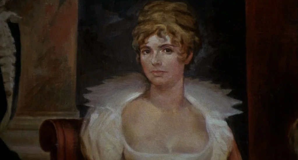 Demons of the Mind (1972) movie still: closeup — An oil painting depicts a woman in a white dress against a dark background. The portrait shows the…