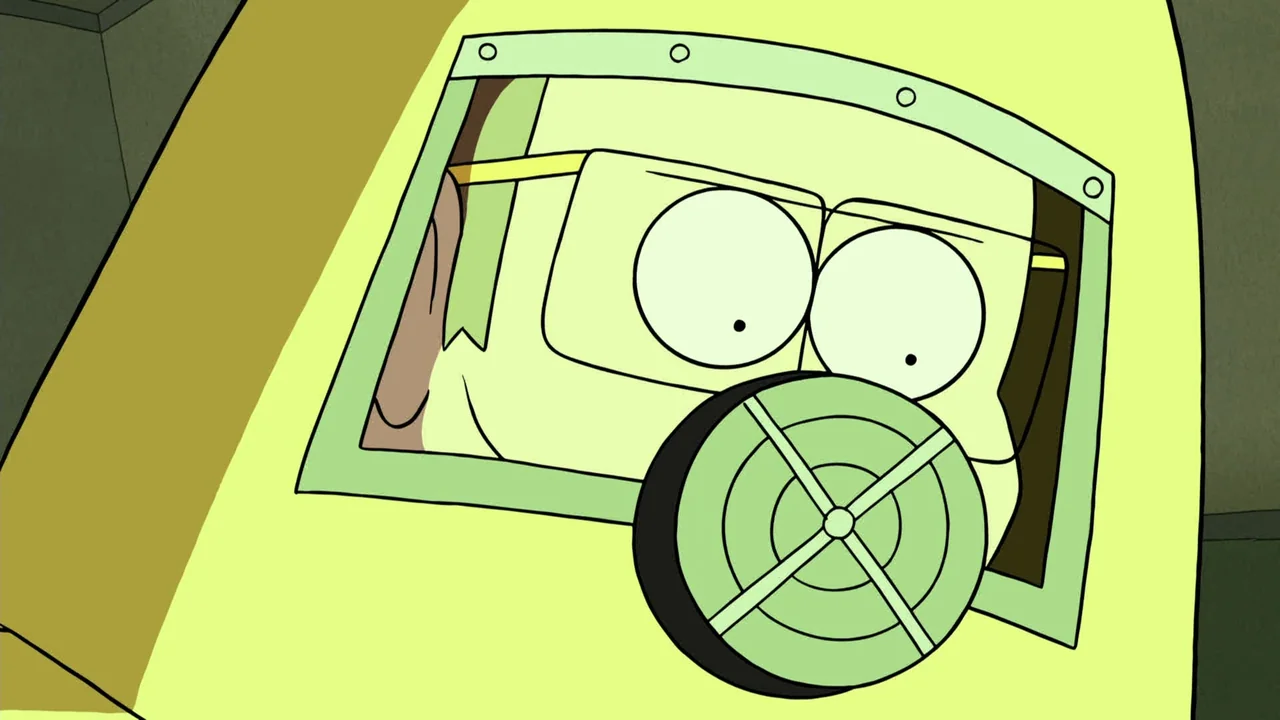 Regular Show: The Movie (2015) movie still: closeup — A close-up of a character wearing a yellow hazmat suit with a clear visor. The character peers…
