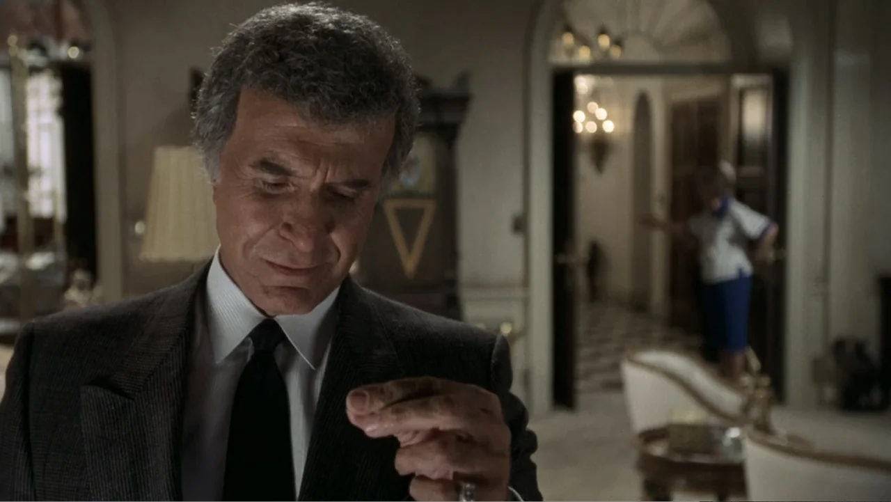 The Naked Gun: From the Files of Police Squad! (1988) movie still: medium — A well-lit foyer inside a mansion features marble flooring and an arched…