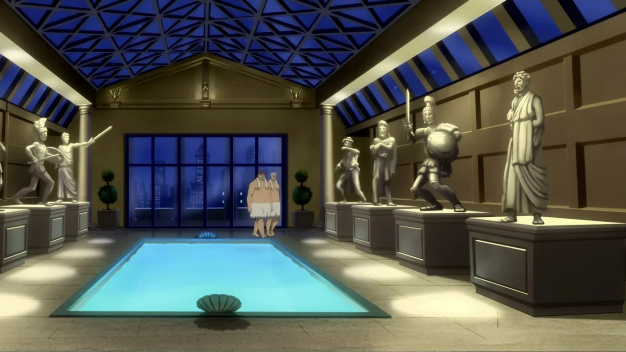 Batman: Year One (2011) movie still: wide — A spacious room features a rectangular swimming pool surrounded by classical-style marble statues on…