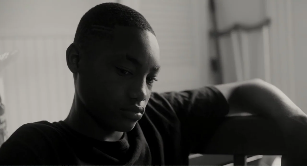 What You Gonna Do When the World's on Fire? (2019) movie still: closeup — A dimly lit interior room with soft textures and blurred architectural…