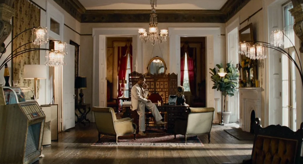 Bad Lieutenant: Port Of Call New Orleans (2009) movie still: wide — A grand, high-ceilinged study with ornate crown molding and dark hardwood…