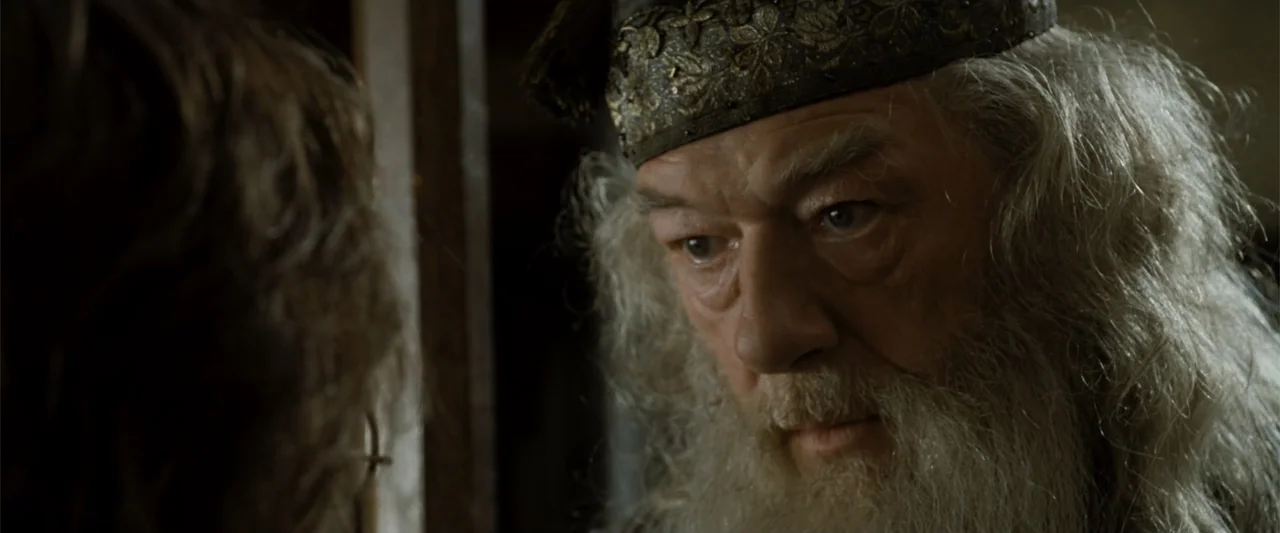 Harry Potter and the Goblet of Fire (2005) movie still: closeup — A dark stone office with wood paneling and aged architectural details. An elderly…