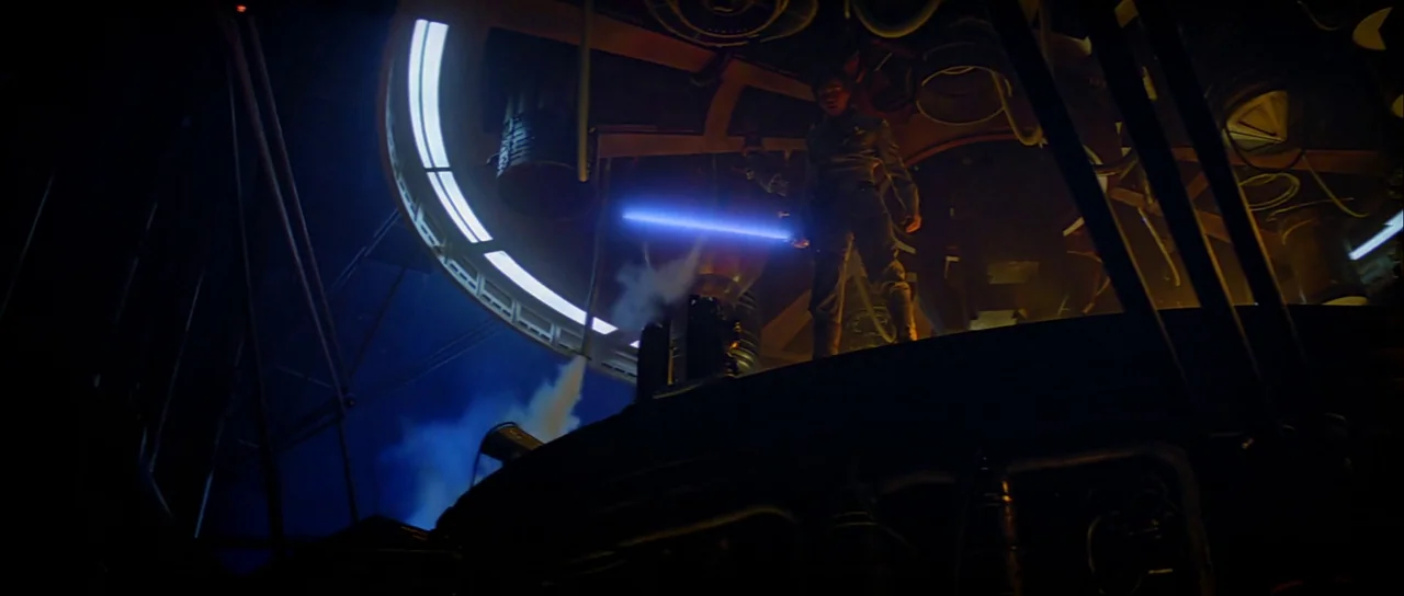 The Empire Strikes Back (1980) movie still: wide — A dark industrial metal platform features complex machinery and curved architectural structures.…