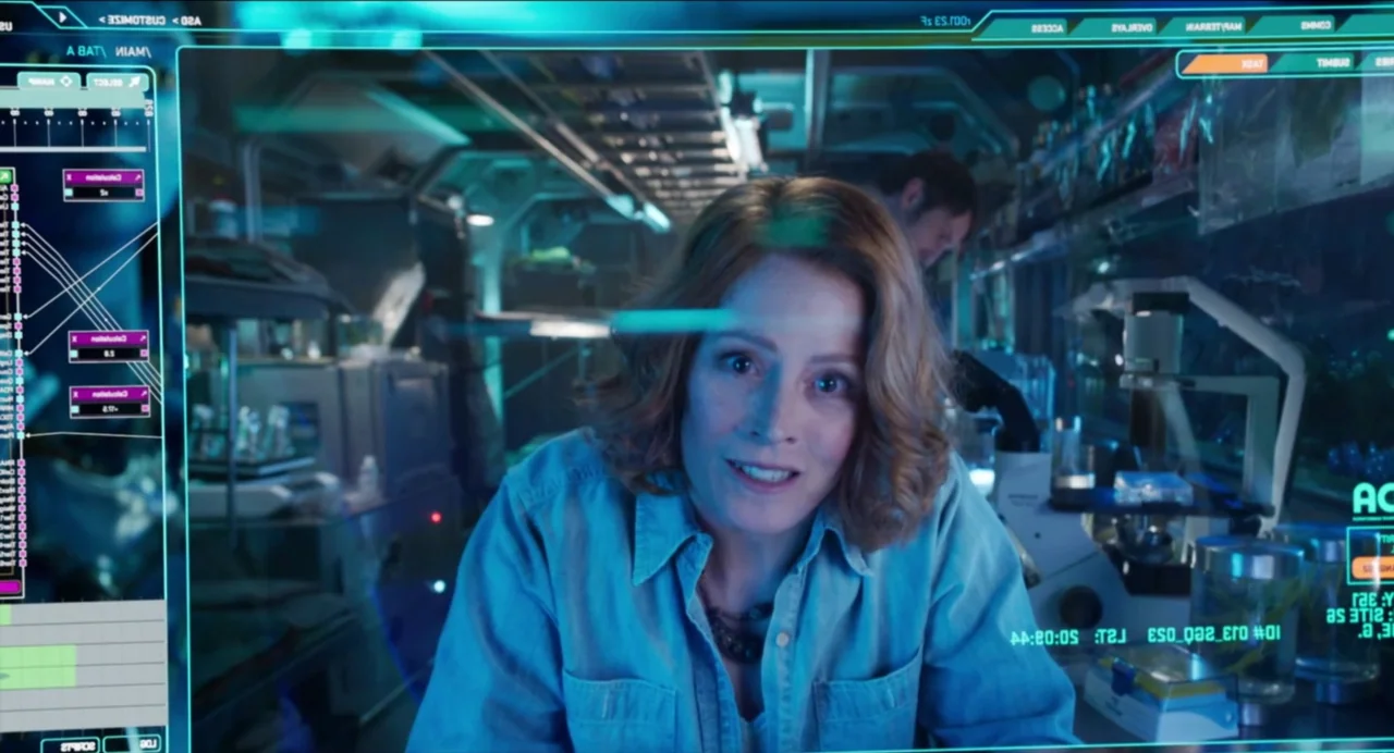 Avatar: The Way of Water (2022) movie still: medium — A high-tech laboratory filled with metallic equipment and glowing transparent data displays. A…