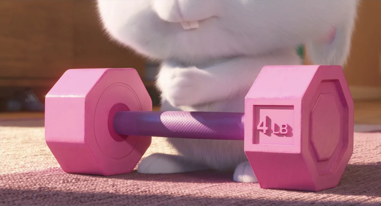 The Secret Life of Pets 2 (2019) movie still: closeup — A close-up of a white rabbit behind a pink four-pound dumbbell on a carpet. The rabbit…