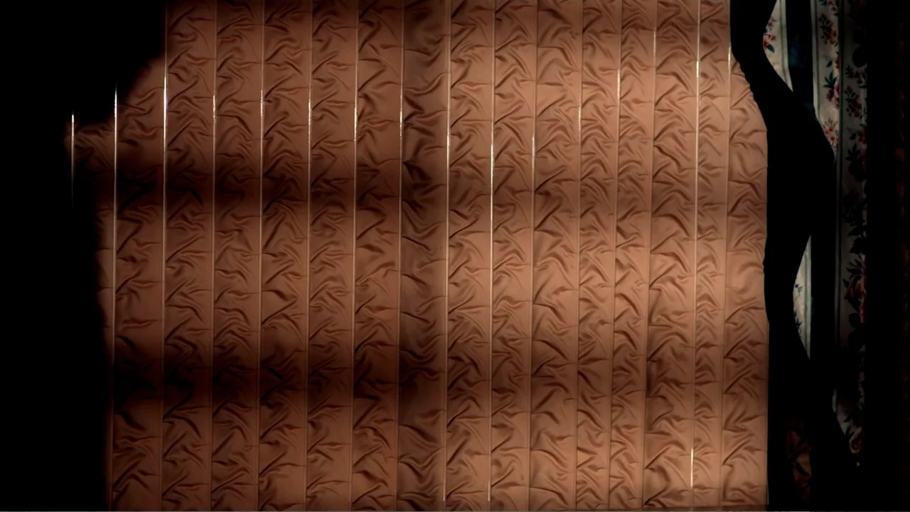 Abandoned Dead (2015) movie still: establishing — A fabric-covered wall features a repeating vertical pattern in a dim interior space. Harsh shadows…