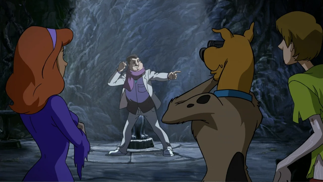 Scooby-Doo! Return to Zombie Island (2019) movie still: medium — A dark rocky cave interior features stone ground textures and dim natural rock…