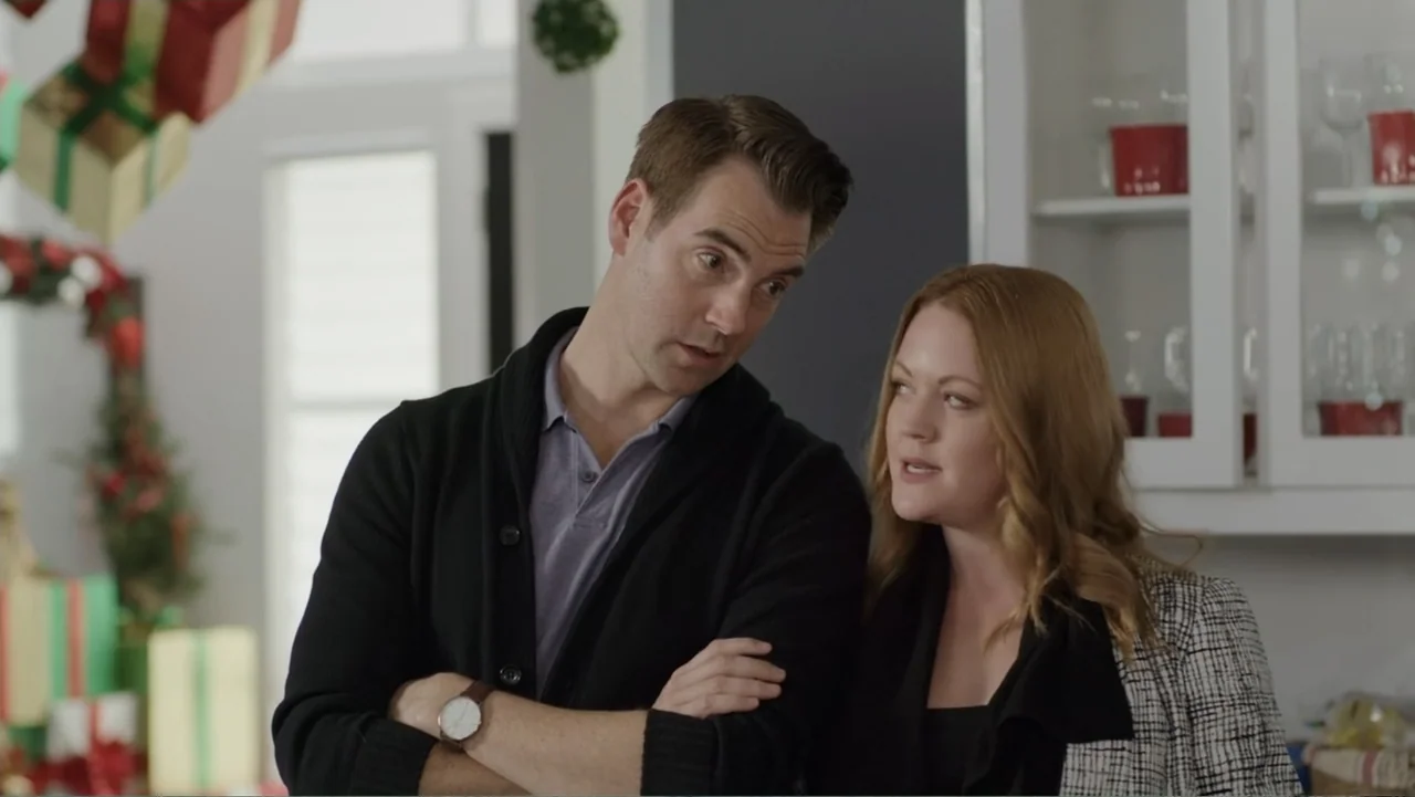 Always and Forever Christmas (2019) movie still: medium — A well-lit domestic interior features festive Christmas-wrapped gifts visible in the…