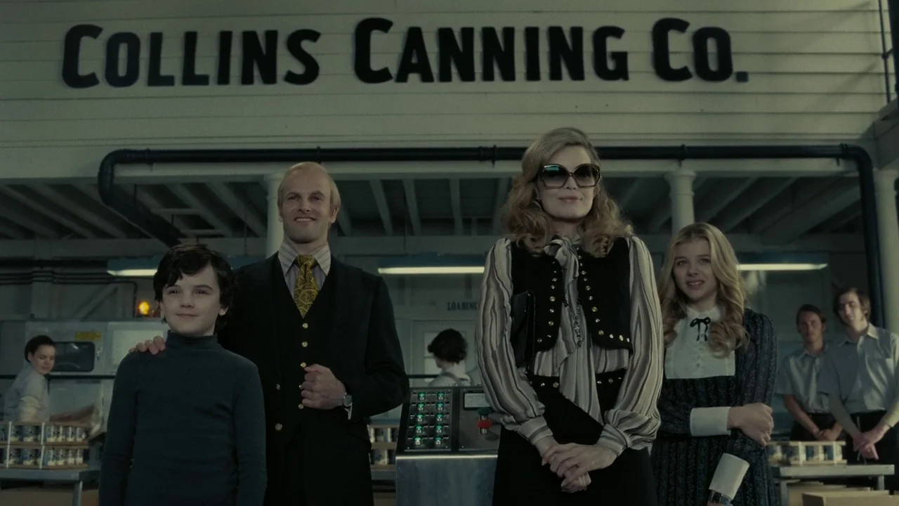 Dark Shadows (2012) movie still: fullbody — The interior of a clean industrial canning facility with a large painted wall sign. A group of four…
