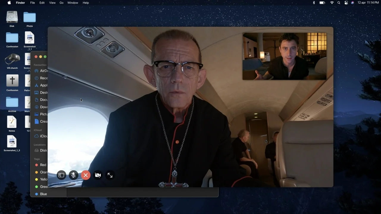 Resurrected (2023) movie still: closeup — An elderly man in clerical robes sits inside an airplane cabin during daylight hours. He is participating…