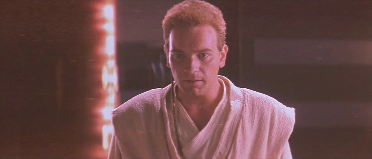 Star Wars: Episode I – The Phantom Menace (1999) movie still: medium — A dark, industrial spaceship corridor features a glowing red light panel on…