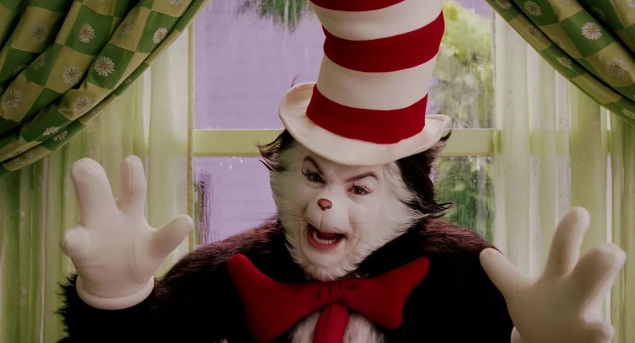 The Cat In The Hat (2003) movie still: closeup — A window frame displays green and white checkered curtains with floral patterns at the edges. The…