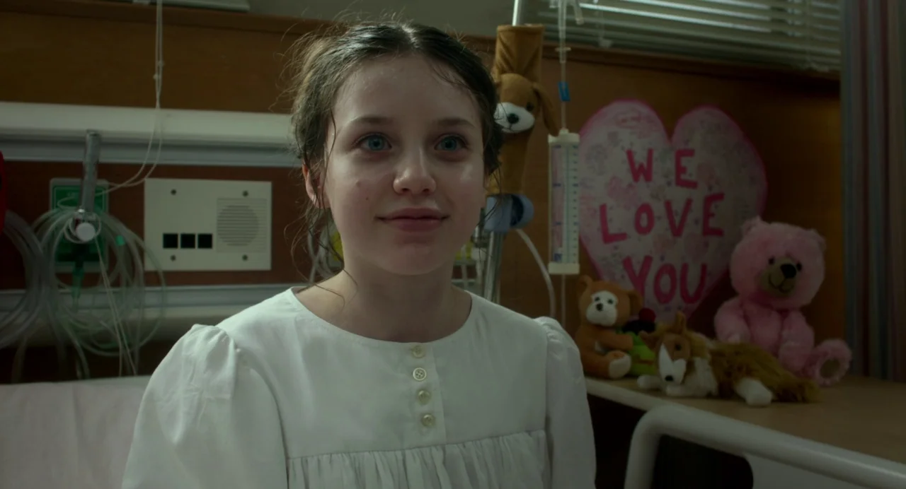 Maps to the Stars (2014) movie still: medium — A hospital setting with medical equipment and decorative stuffed animals on the bedside table. A…