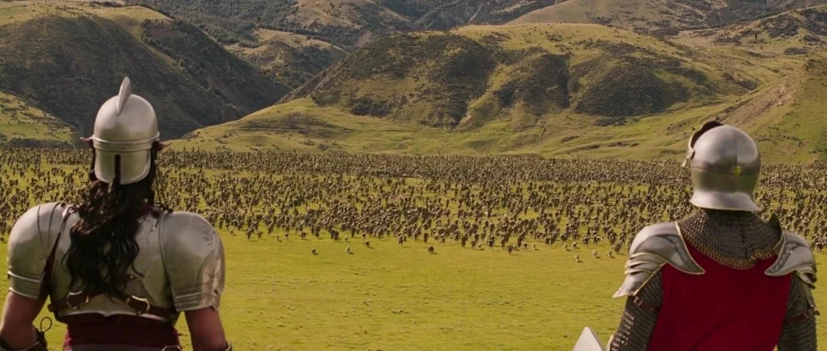 The Chronicles of Narnia: The Lion, the Witch and the Wardrobe (2005) movie still: wide — Two armored soldiers stand in the foreground overlooking a…