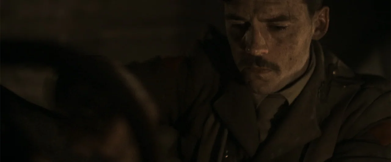 Gone Missing -  Old John's Final Journey (2014) movie still: closeup — A dimly lit room with heavy shadows and muted colors suggesting a confined…