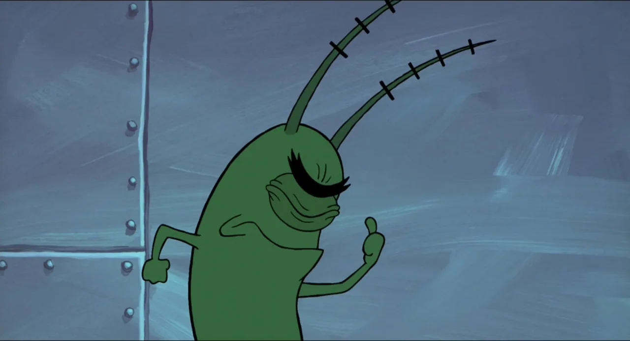The SpongeBob SquarePants Movie (2004) movie still: medium — A small green character stands against a flat, blue-painted metal wall surface. The…