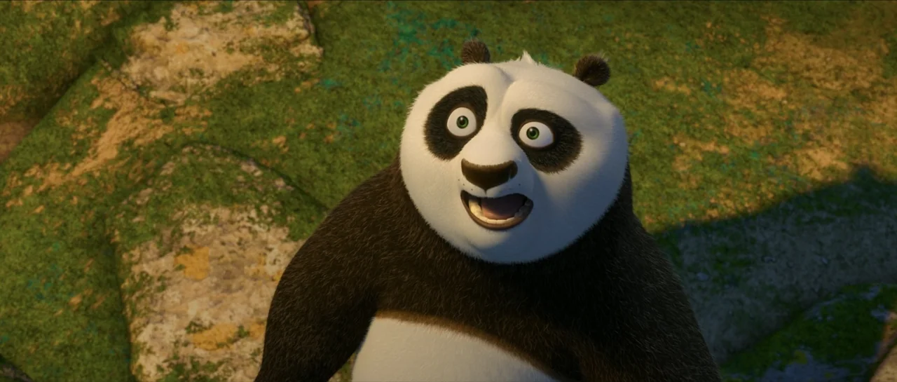 Kung Fu Panda (2008) movie still: medium — An anthropomorphic panda stands in a rocky outdoor terrain during golden hour. The panda looks up with a…
