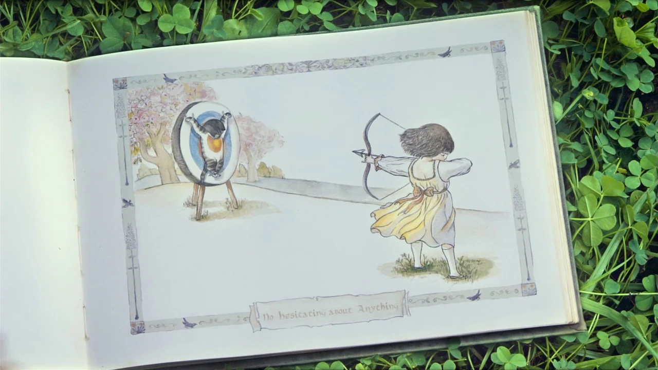 I’m A Cyborg, But That’s Okay (2006) movie still: closeup — An open illustrated storybook rests on a patch of lush green clover leaves. The page…