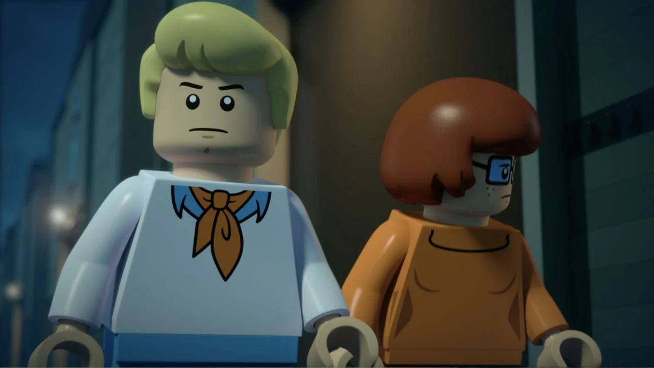 LEGO Scooby-Doo! Haunted Hollywood (2016) movie still: medium — A night scene featuring two LEGO figures standing together on an outdoor city…