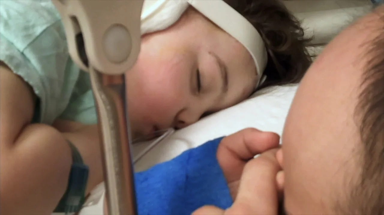 Moonlight Sonata: Deafness in Three Movements (2019) movie still: closeup — A sterile hospital room environment features white pillows and medical…