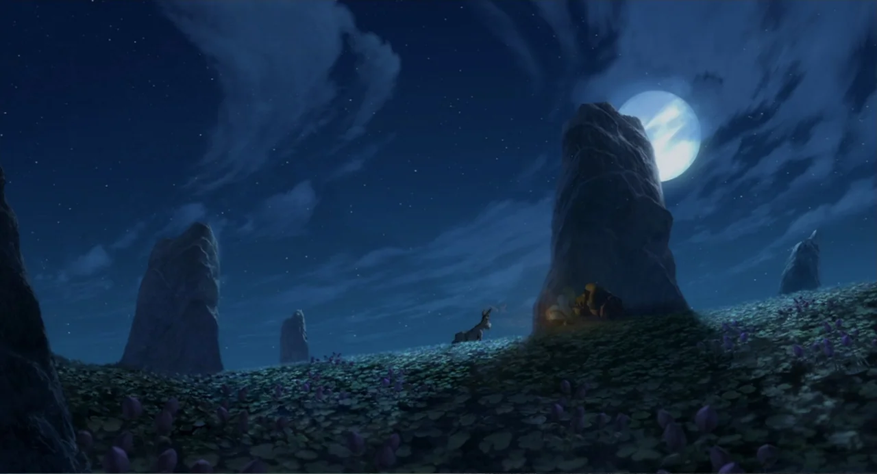 Shrek (2001) movie still: wide — A dark, rolling field at night features tall rock monoliths and a full moon. A donkey and an ogre are silhouetted…