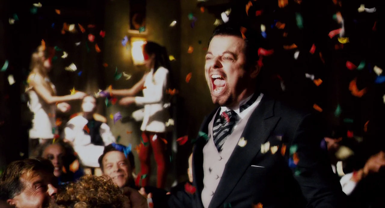 Repo! The Genetic Opera (2008) movie still: medium — A dimly lit nightclub space is filled with falling multi-colored confetti particles. A man in a…