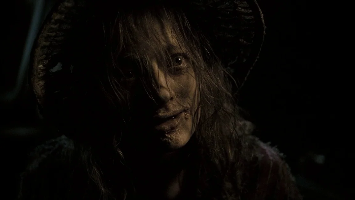 Sweeney Todd: The Demon Barber of Fleet Street (2007) movie still: closeup — A dark, undifferentiated interior space obscures the background in deep…