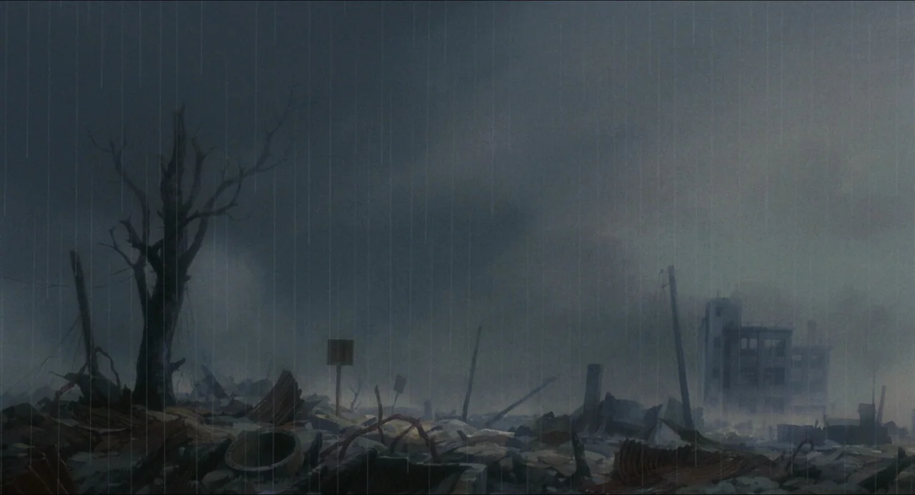 Grave of the Fireflies (1988) movie still: establishing — A desolate urban landscape filled with concrete rubble and twisted metal debris during…