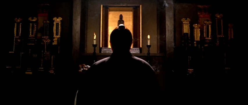 Lone Wolf and Cub: Sword of Vengeance (1972) movie still: medium — A dimly lit traditional Japanese shrine featuring black lacquer panels and…