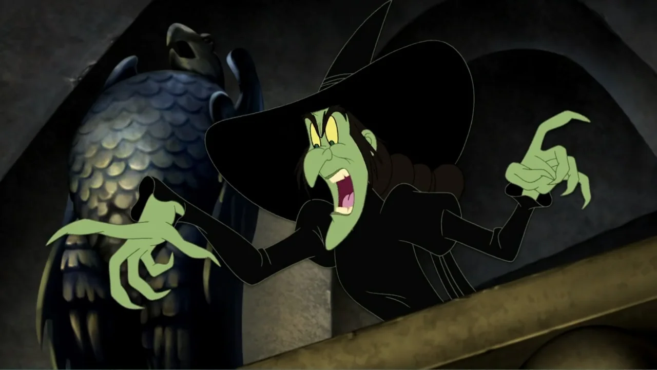 Tom and Jerry & The Wizard of Oz (2011) movie still: medium — A stone castle interior contains a stone eagle sculpture and a green-skinned witch.…