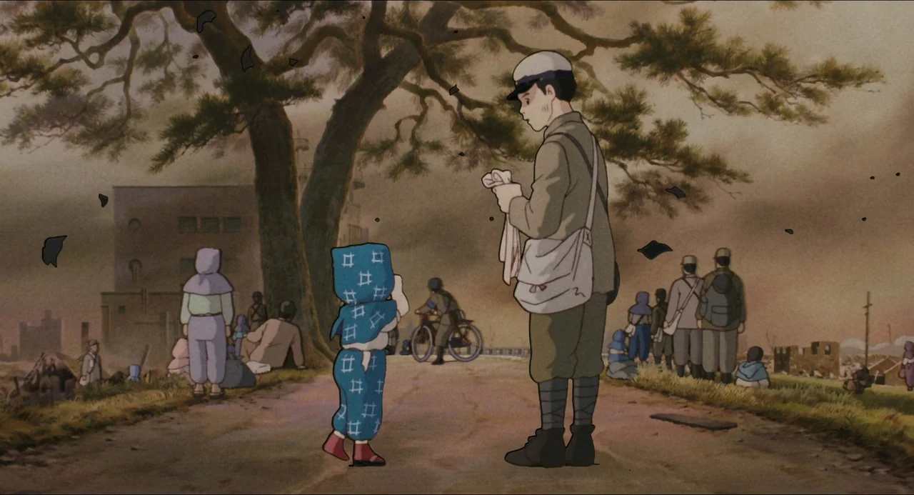 Grave of the Fireflies (1988) movie still: fullbody — A war-torn landscape features displaced people scattered along a rural dirt path. A young…