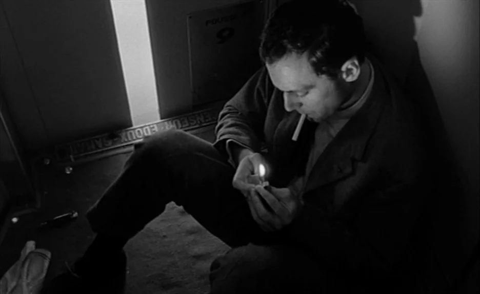 Elevator To The Gallows (Ascenseur pour l’échafaud) (1958) movie still: medium — A man sits on the floor of a metallic elevator car at night. He is…