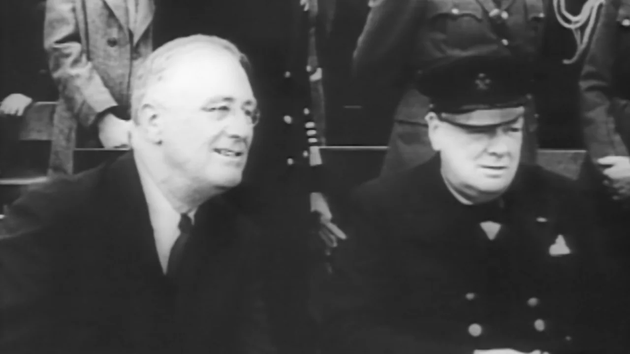 The Soul of America (2020) movie still: medium — Two world leaders sit together in an outdoor area during the 1940s. Franklin Roosevelt and Winston…